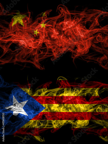 China  Chinese vs Catalonia  Catalan  Catalonian  Spain smoky mystic flags placed side by side. Thick colored silky abstract smoke flags.