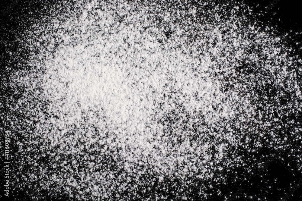 Flour on a black background. Abstract background. Flour on a black background. Abstract background.