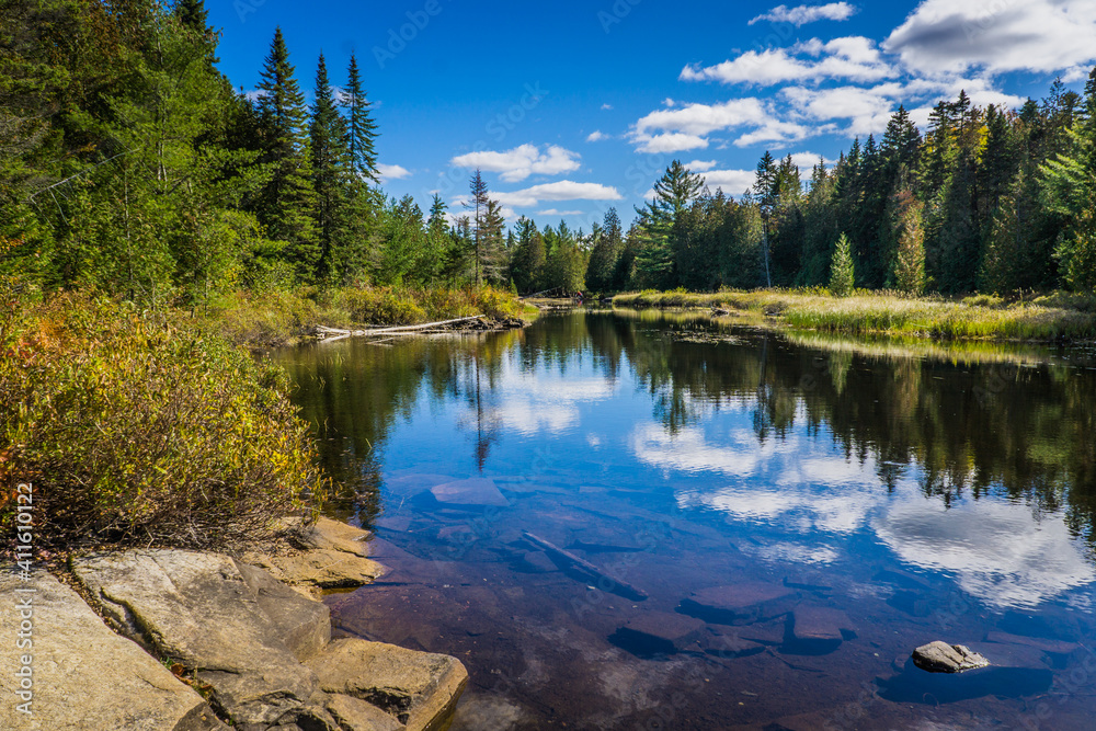 The Cascades hiking trail in Mauricie National Park (Quebec, Canada) with typical canadian landscape, on a clear fall day