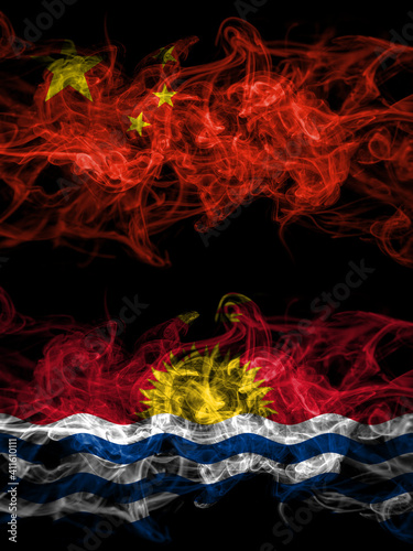 China, Chinese vs Kiribati smoky mystic flags placed side by side. Thick colored silky abstract smoke flags.