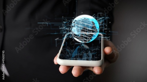 Human hand holding mobile phone with earth globe holographic technology . Futuristic visualization for virtual reality and augmented reality . photo