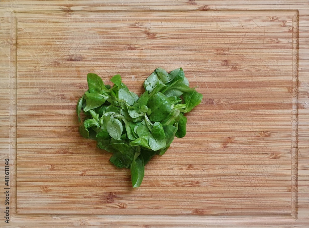 Heart shape made with vegetables, on wooden board. Template with copyspace for healthy, vegetarian, vegan food themes. Heart shape made with vegetables, on wooden board. Template with copyspace for healthy, vegetarian, vegan food themes.