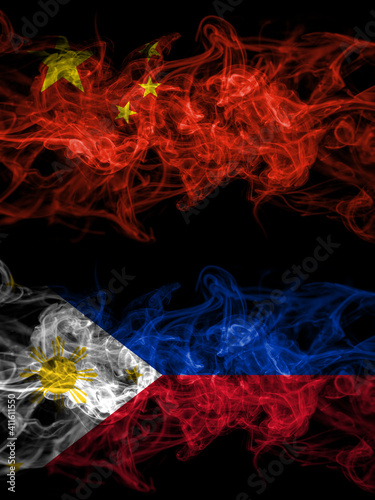 China, Chinese vs Philipines smoky mystic flags placed side by side. Thick colored silky abstract smoke flags.