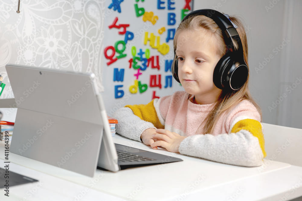 remote education and work, a girl with a laptop with a white screen (space for text) remote education and work, a girl with a laptop with a white screen (space for text)