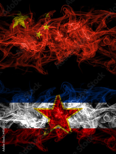 China, Chinese vs Yugoslavia, Yugoslavian smoky mystic flags placed side by side. Thick colored silky abstract smoke flags.