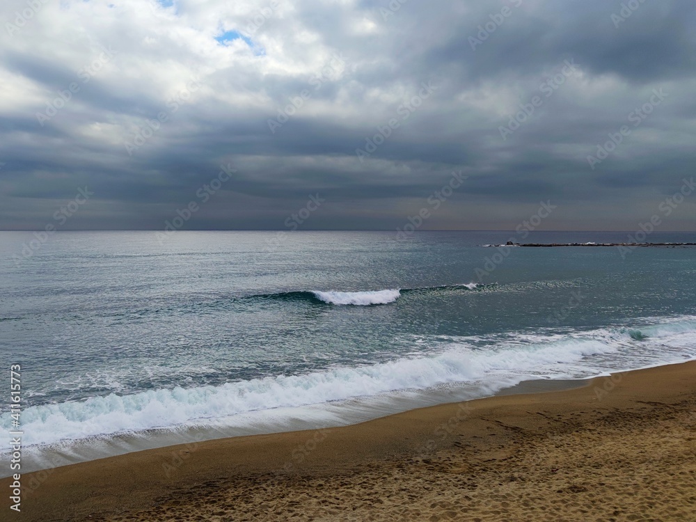 nostalgic,seascape,shore, riverside of a spanish mediterranean beach with clouds at autumn / winter

