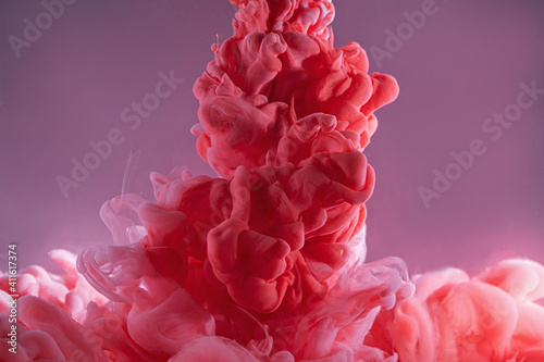 Red and pink ink in water, liquid color backdrop