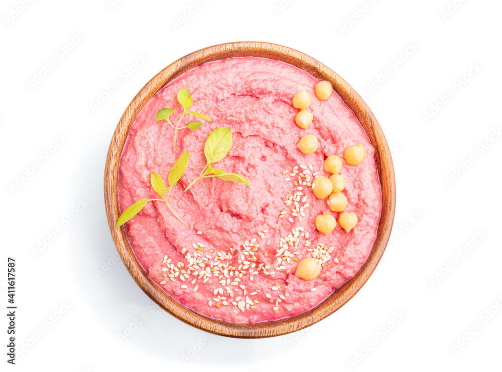 Hummus with beet in wooden bowl isolated on white background. Top view. Hummus with beet in wooden bowl isolated on white background. Top view.