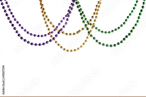 Three colour Merdi gras beads isolated on white background