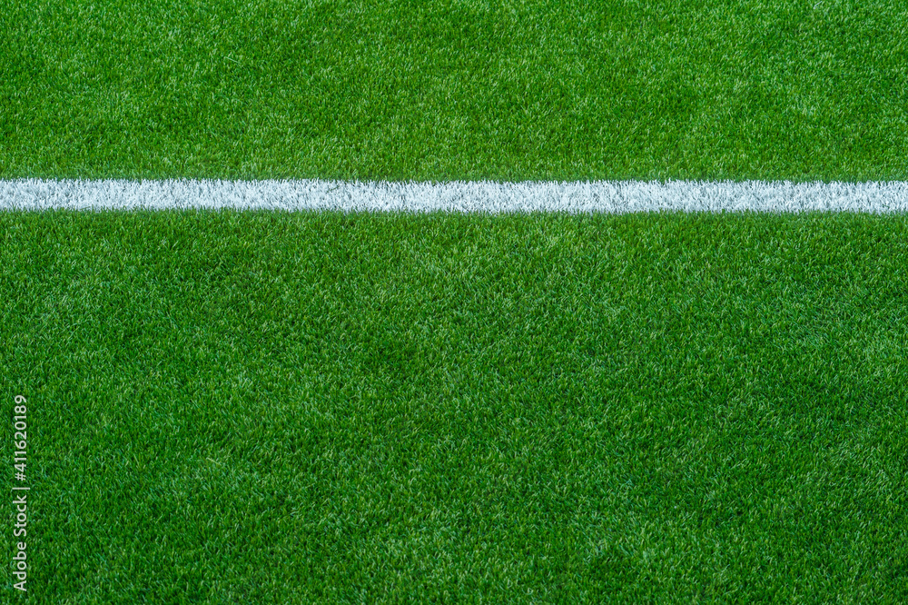 Green Synthetic Grass Sports Field with White Line Stock Photo