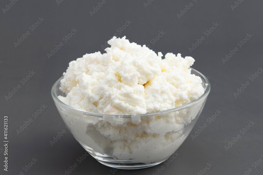 Freshly Churned White Butter Also Known As Safed Makhan Malai Or Homemade Makkhan In India Is Used To Prepare Desi Ghee In Ceramic Glass Bowl. Isolated On Grey Background With Copy Space For Text Freshly Churned White Butter Also Known As Safed Makhan Malai Or Homemade Makkhan In India Is Used To Prepare Desi Ghee In Ceramic Glass Bowl. Isolated On Grey Background With Copy Space For Text