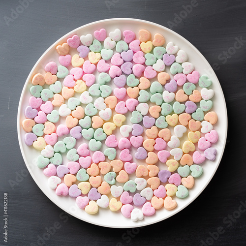 Candy hearts on a round plate