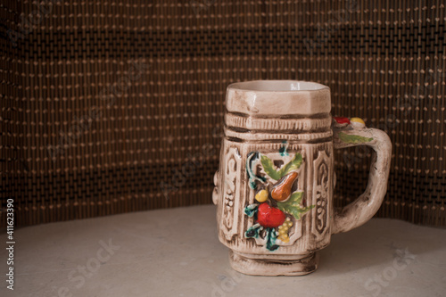 A colorful ceramic empty mug for coffee or tea. Home interior. photo