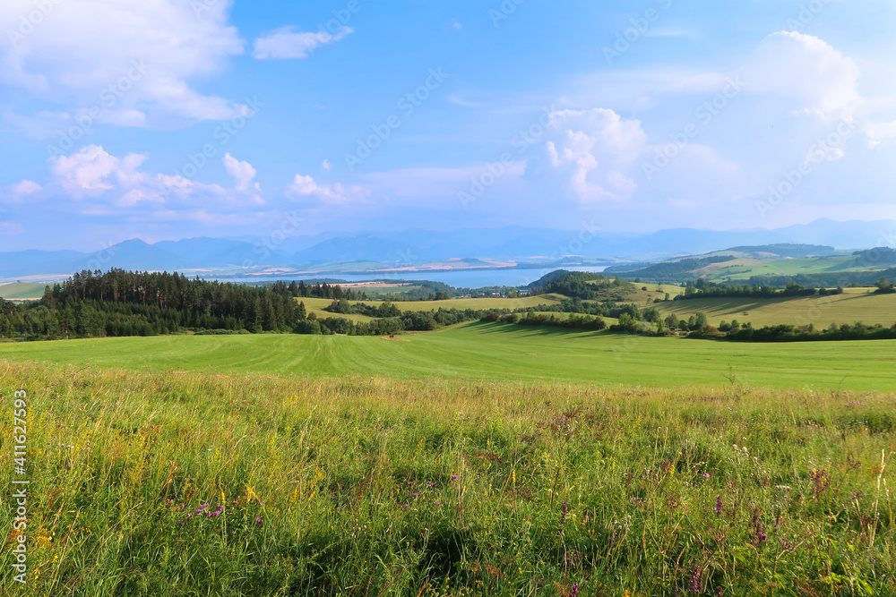 Liptov panorama with Low Tatras (Nizke Tatry) and Liptovska Mara water lake reservoir in the background. Summertime in the Northern Slovakia, Slovak Republic, Europe.