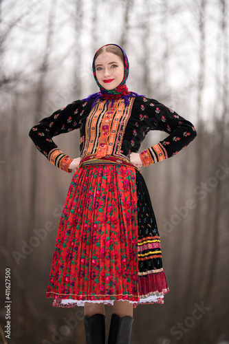 Slovak folklore. Traditional folk costume. Beautiful folk dancer in winter.