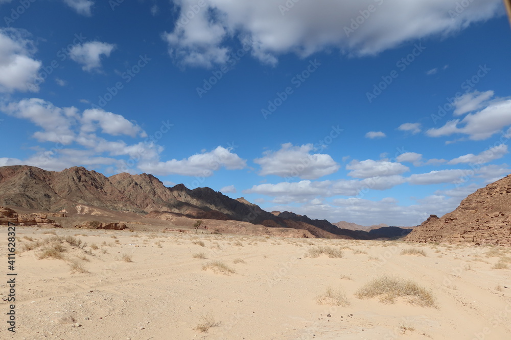 empty desert road between the hills and mountains in Sinai in Egypt empty desert road between the hills and mountains in Sinai in Egypt