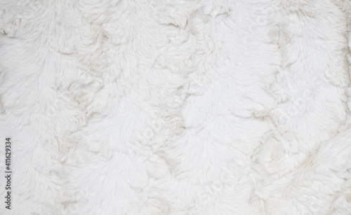 Soft white fur background. Light artificial fur textile material. © Cloudy Design