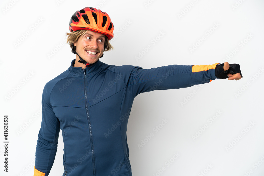 Young blonde cyclist man isolated on white background giving a thumbs up gesture Young blonde cyclist man isolated on white background giving a thumbs up gesture