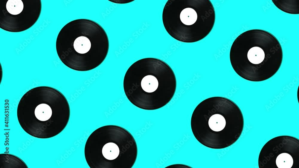 Retro vinyl disks in geometric pattern on a blue background. Simple motion graphics music animation concept Retro vinyl disks in geometric pattern on a blue background. Simple motion graphics music animation concept