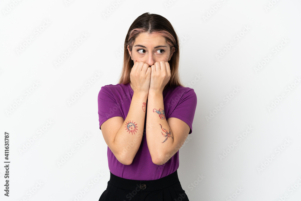 Young caucasian woman isolated on white background nervous and scared putting hands to mouth Young caucasian woman isolated on white background nervous and scared putting hands to mouth