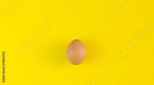 Egg on a yellow background. Background for design. Easter background. Easter.Copy space.