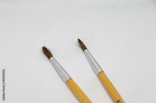 Two art brushes for drawing close-ups on a white background.