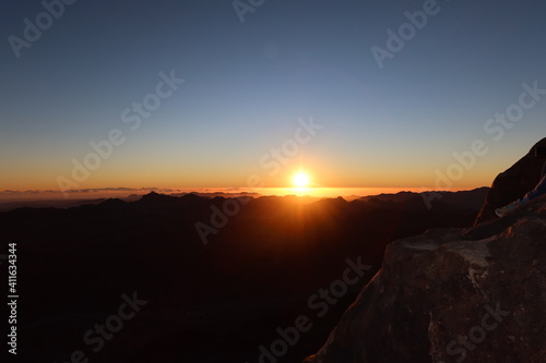 The beautiful and serene sunrise on top of the Moses mountain in Saint Catherin in Sinai in Egypt photo