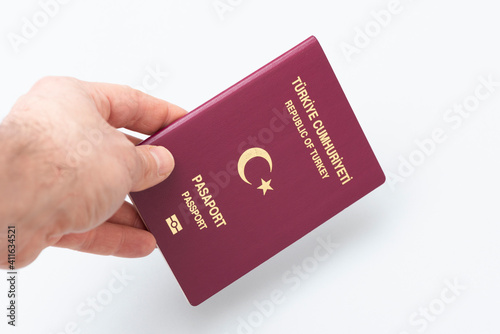 Turkish citizen public passport on the hand.