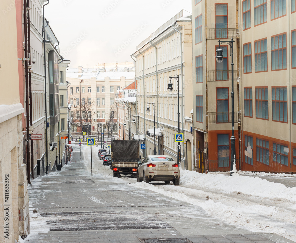 Moscow, Russia, Jan 15, 2021: Nizhny Kiselny side street. A lot of snow Descent  towards Neglinnaya street