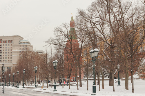 Moscow, Russia. Alley in Alexander garden. The Kremlin wall and tower. Winter. A lot of snow