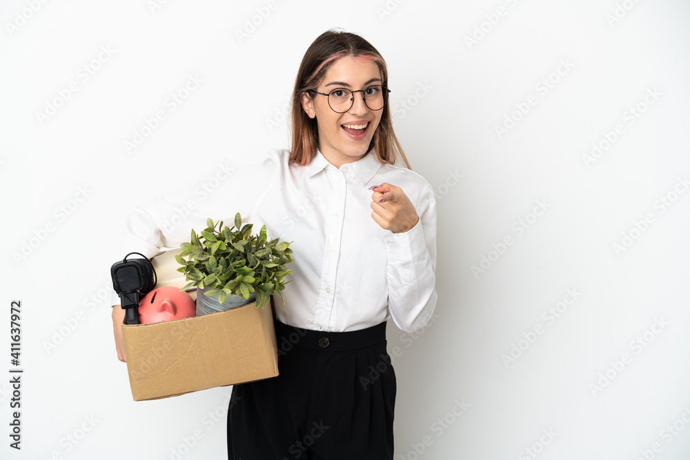 Young caucasian woman moving in new home among boxes isolated on white background surprised and pointing front Young caucasian woman moving in new home among boxes isolated on white background surprised and pointing front