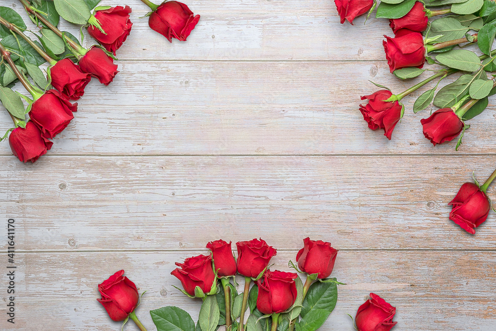 Bouquets of red roses around on wooden wall. Layout for postcards, invitations for Valentine's Day 14 february, Engagement, wedding anniversary, Birthday  preparation.