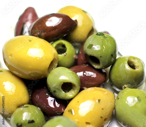 Mix of olives over white background. photo