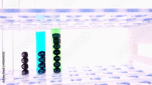 Test Tubes With New Covid Strains Samples From Experiments on Covid-21 Covid-22 In A Laboratory Rack  photo