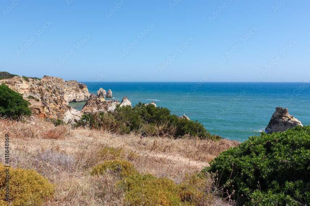 Beautiful coastline rocky seascape, Praia dos três Irmãos, Alvor, Algarve