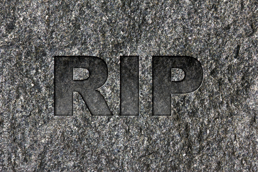 RIP etched in bold, dark gray text on black granite. RIP etched in bold, dark gray text on black granite.