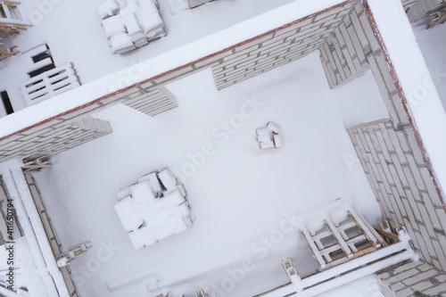 Above view of unfinished house walls in winter