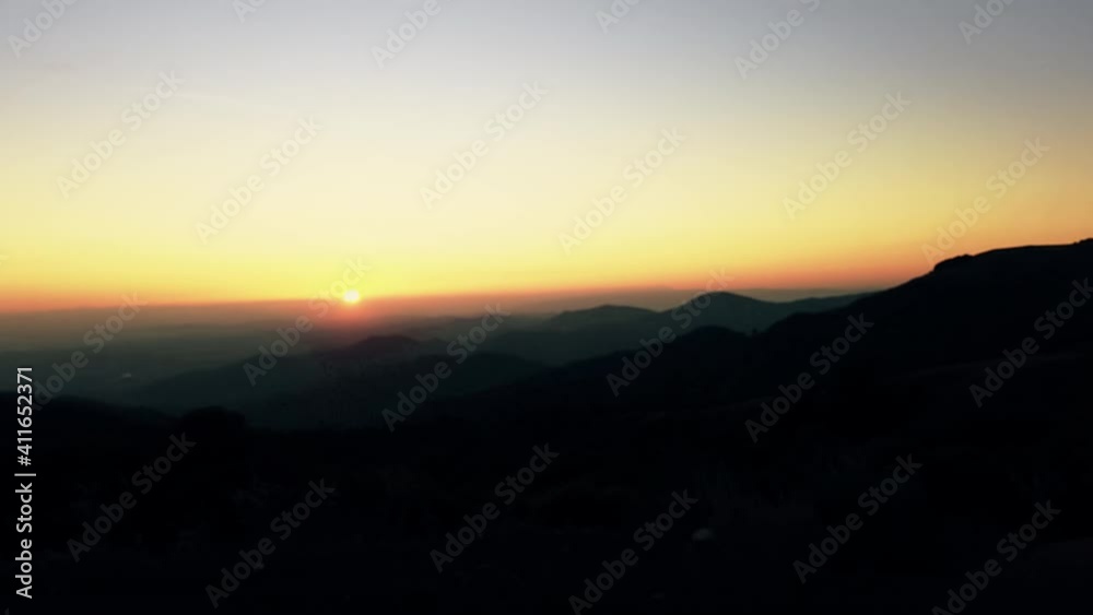 High altitude mountain road drive at sunset with amazing view of the valley
