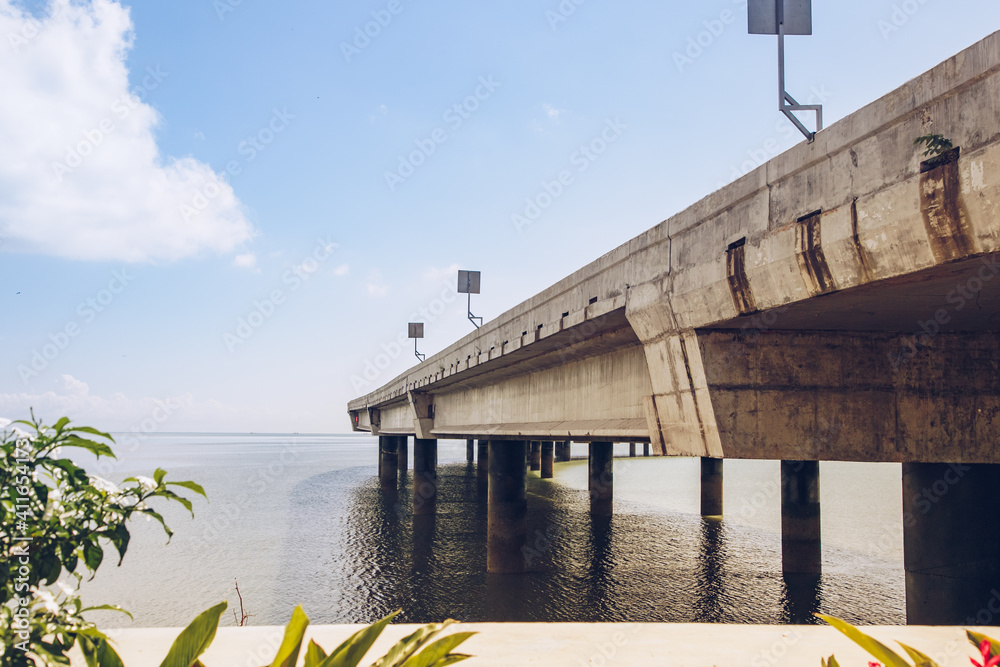 Bridge over the water. Floating bridge close to the water. Highway over a river. 
