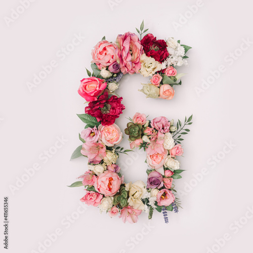 Letter G made of real natural flowers and leaves. Flower font concept. Unique collection of letters and numbers. Spring, summer and valentines creative idea. © Zamurovic Brothers