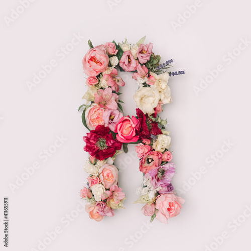 Letter R made of real natural flowers and leaves. Flower font concept. Unique collection of letters and numbers. Spring, summer and valentines creative idea. © Zamurovic Brothers