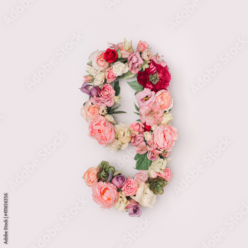 Number 9 made of real natural flowers and leaves. Flower font concept. Unique collection of letters and numbers. Spring, summer and valentines creative idea. © Zamurovic Brothers