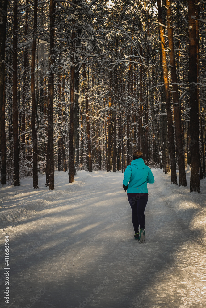 Running on the road in the winter forest
