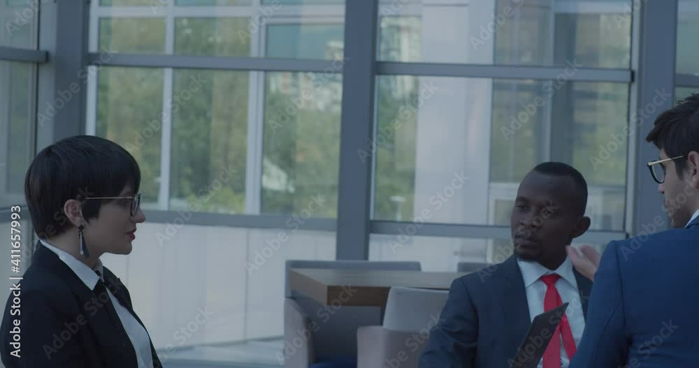 Business team talking about work in the lobby