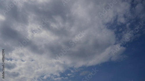 Gray clouds are running across the sky. Weather before rain and windy. Out of town