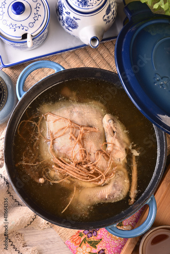 Ginseng chicken soup in cast iron pot.