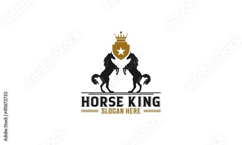 the king of horses logo with two strong looking horses that convey the message that he is the king