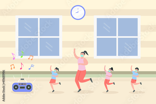 Children dancing with their teacher while wearing face mask and listening music on the radio
