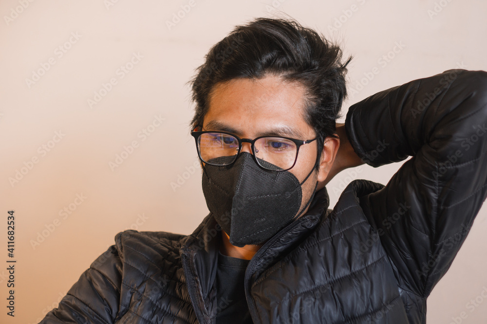 young man working with computer from his quarantined office