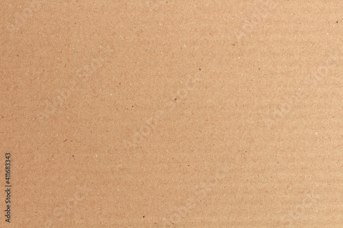 Cardboard sheet texture background, detail of recycle brown paper box pattern.